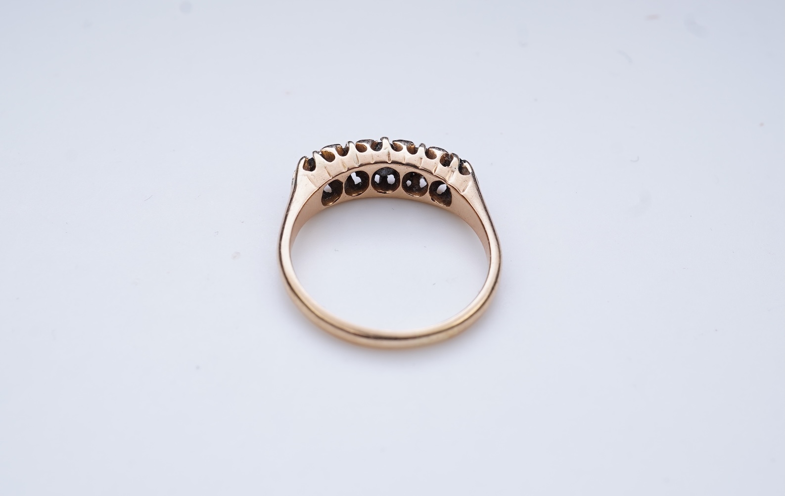 A sapphire and diamond five-stone ring, circa 1902